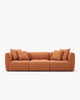 Sofa modułowa AURA (3 el.) - widok z przodu na modułową sofę z poduszkami, o zaokrąglonych kształtach.