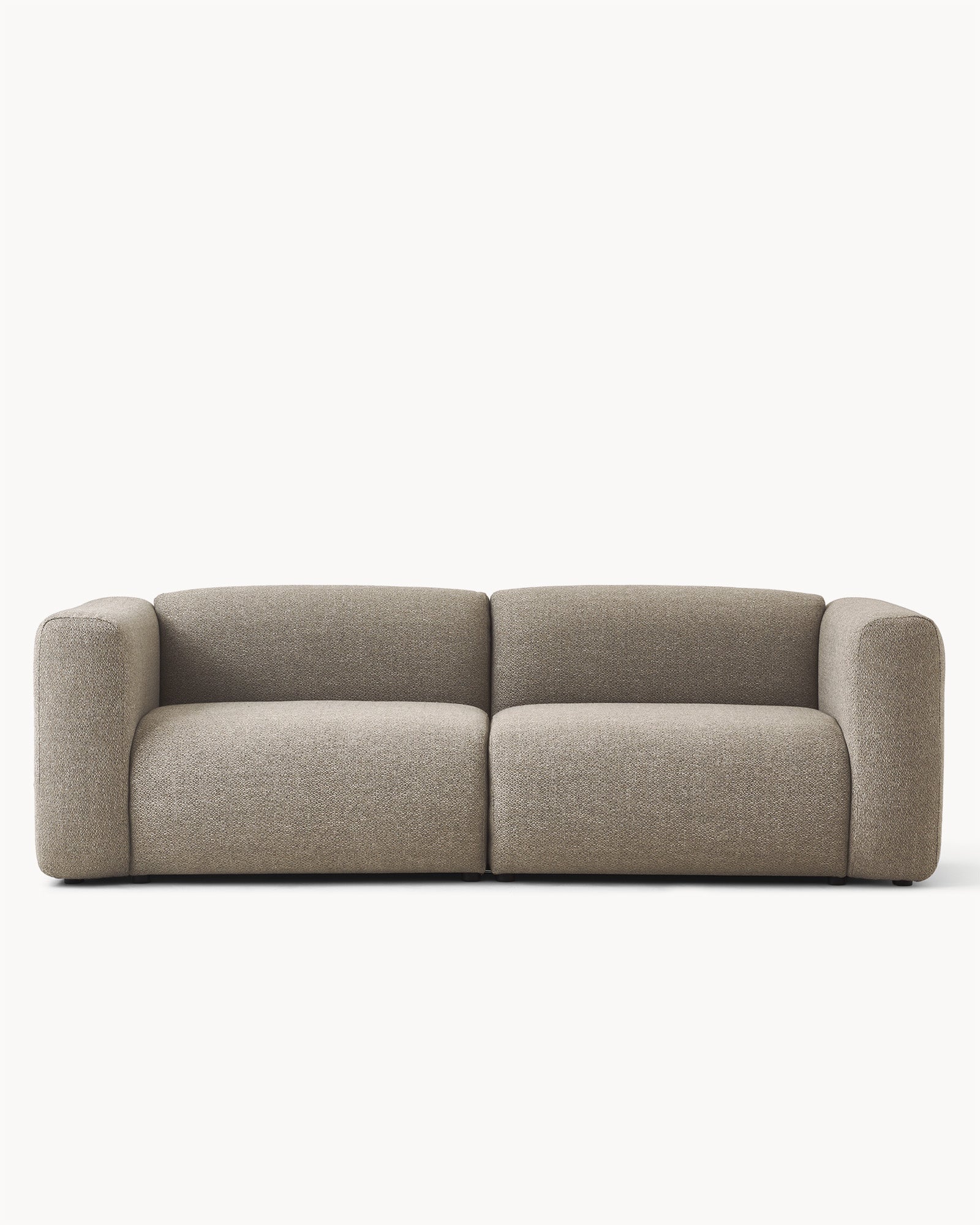 Sofa modułowa MODULO - sofa modułowa widoczna z przodu, z zaokrąglonymi bokami i prostym kształtem.