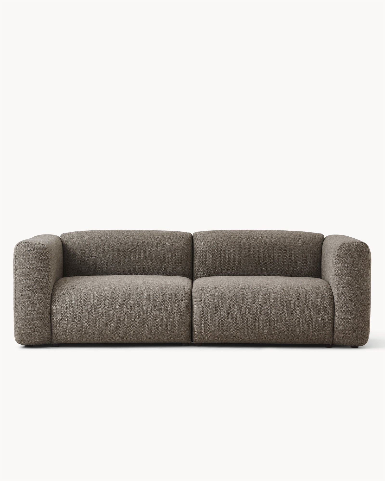 Sofa modułowa MODULO - sofa modułowa widoczna z przodu, z zaokrąglonymi bokami i prostym kształtem.