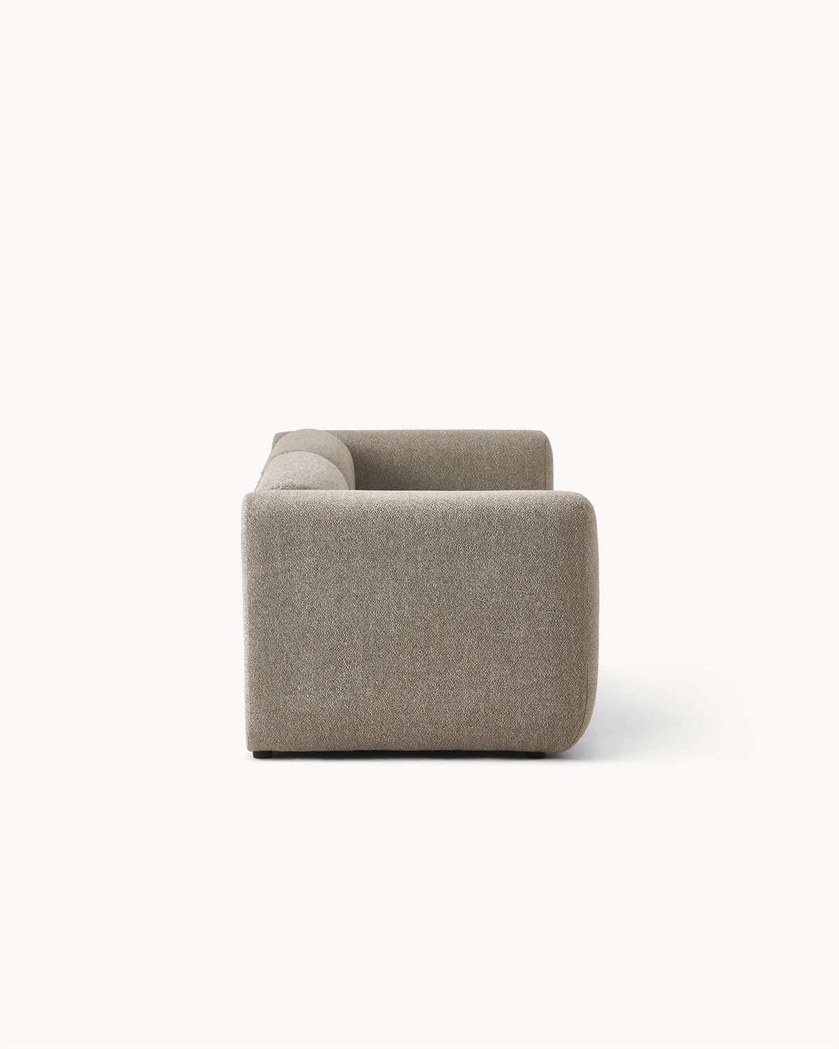 Sofa modułowa MODULO - widok z boku na sofę modułową z zaokrąglonymi krawędziami i prostą formą.