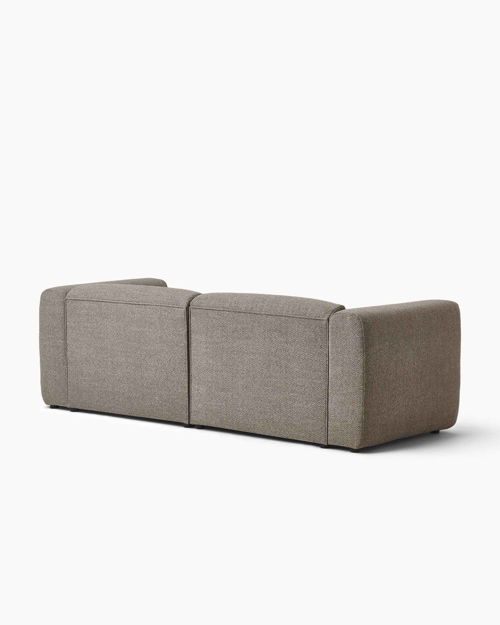 Sofa modułowa MODULO - widok z boku na modułową sofę z zaokrąglonymi bokami i prostą formą.